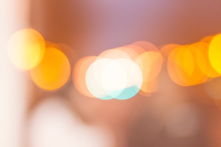 A soft-focus abstract image with warm bokeh lights creating a dreamy effect.